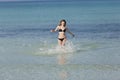 Woman with bikini jumping in the sea hochformat Royalty Free Stock Photo