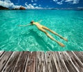 Woman in bikini lying on water Royalty Free Stock Photo