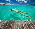 Woman in bikini lying on water Royalty Free Stock Photo