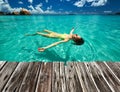 Woman in bikini lying on water Royalty Free Stock Photo