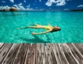 Woman in bikini lying on water Royalty Free Stock Photo