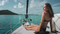 Woman in bikini relaxes sitting on yacht deck Royalty Free Stock Photo