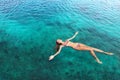 Woman in bikini relaxing lying on the water Royalty Free Stock Photo