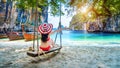 Woman in bikini relaxing on swing at Ko lao lading island, Krabi, Thailand