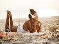 Woman in Bikini with a Smartphone and Headphones on the Beach Royalty Free Stock Photo