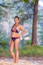 Woman with bikini stand in nature