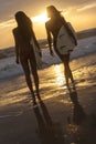 Woman Bikini Surfer Girls & Surfboards Sunset Beach Royalty Free Stock Photo