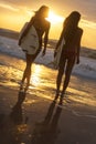 Woman Bikini Surfer Girls & Surfboards Sunset Beach Royalty Free Stock Photo