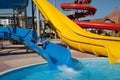 Woman in bikini on swimming pool water slide Royalty Free Stock Photo