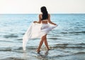 woman in bikini swimsuit with pareo on beach Royalty Free Stock Photo