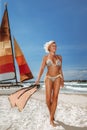 Woman in bikini with yacht Royalty Free Stock Photo