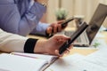 Woman with bills and smart phone at the table Royalty Free Stock Photo