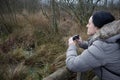 Woman with binoculars birdwatching