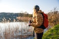 Woman biologist is watching birds with binoculars