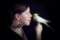 Woman and bird on black background Royalty Free Stock Photo