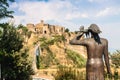 Woman and bird statue looking at Civita di Bagnoregio