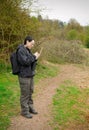 Woman birdwatching with notepad Royalty Free Stock Photo