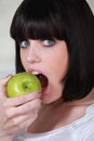 Woman biting apple Royalty Free Stock Photo