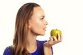 Woman biting green apple