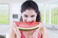 Woman biting a slice of watermelon Royalty Free Stock Photo