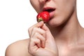 Woman biting strawberry on white Royalty Free Stock Photo