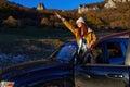 woman black car nature travel adventure relaxation Royalty Free Stock Photo