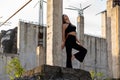 Woman in Black Casual Outfit with Exposed Pillars Royalty Free Stock Photo