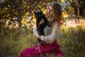 Victorian style, woman at autumn garden with a cat Royalty Free Stock Photo