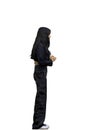 A woman in black clothes, on a white background, in full height Royalty Free Stock Photo