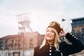 Woman in black coal miner foreman gala uniform with white feather on hat. Royalty Free Stock Photo