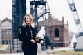 Woman in black coal miner foreman gala uniform with white feather on hat. Royalty Free Stock Photo