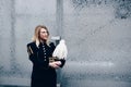 Woman in black coal miner foreman gala uniform with white feather on hat. Royalty Free Stock Photo