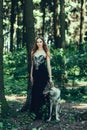 Woman in black dress with dog