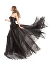 Woman Black Dress Flying on Wind, Beautiful Fashion Model in Fluttering Chiffon Gown on White Royalty Free Stock Photo