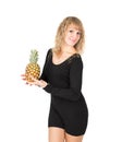 Woman in black dress with pineapple
