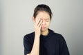 Woman in a black dress is touching head to show her headache. Causes may be caused by stress or migraine. Royalty Free Stock Photo