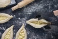 Woman in black gloves holds raw khachapuri. Process of making bakery. Adjarian Khachapuri Recipe Ã¢â¬â Georgian cheese bread. Top Royalty Free Stock Photo