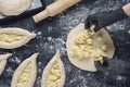 Woman in black gloves spread the cheese filling on the dough. Process of making bakery. Adjarian Khachapuri Recipe Ã¢â¬â Georgian Royalty Free Stock Photo