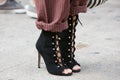 Woman with black high heel shoes and shoelaces before Cristiano Burani fashion show, Milan Fashion Week