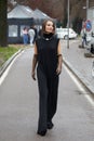 Woman with black jumpsuit and transparent gloves before Sportmax fashion show, Milan Fashion Royalty Free Stock Photo