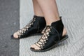 Woman with black leather open sandals before Max Mara fashion show, Milan Fashion Week street style on