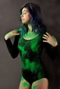 Woman in Black Leotard Covered in Green Poweder