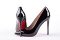 Woman black louboutin on white background.