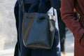 Woman with black Mansur Gavriel leather bag before Giorgio Armani fashion show, Milan Fashion Week street Royalty Free Stock Photo