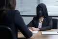 Woman in a black mask sitting at the desk and talking to another woman. black mask close up office boss taking interview, AI Royalty Free Stock Photo