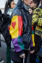 Woman with black, red, yellow, green leather jacket and blue hair before John Richmond fashion