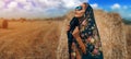 Woman in black russian shawl In Harvested Field Royalty Free Stock Photo