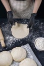 Woman in black shirt and black gloves holds rolled out yeast dough. Process of making bakery. Adjarian Khachapuri Recipe Ã¢â¬â Royalty Free Stock Photo