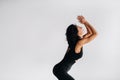 A woman in black sportswear is engaged in dynamic kali meditation in the Yoga hall Royalty Free Stock Photo