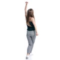 Woman in black t-shirt and pants happiness dancing hands up Royalty Free Stock Photo